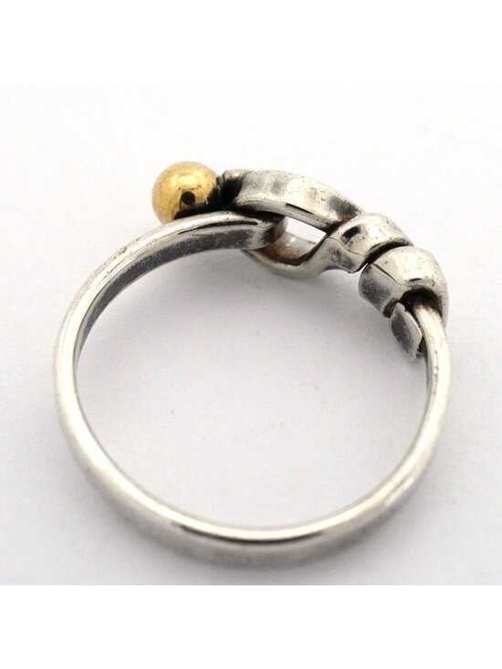 This vintage Hook Eye Ring by Tiffany & Co. is crafted in  Tiffany & Co Ring Hook Eye 18k Yellow Gold 925 Sterling Silver